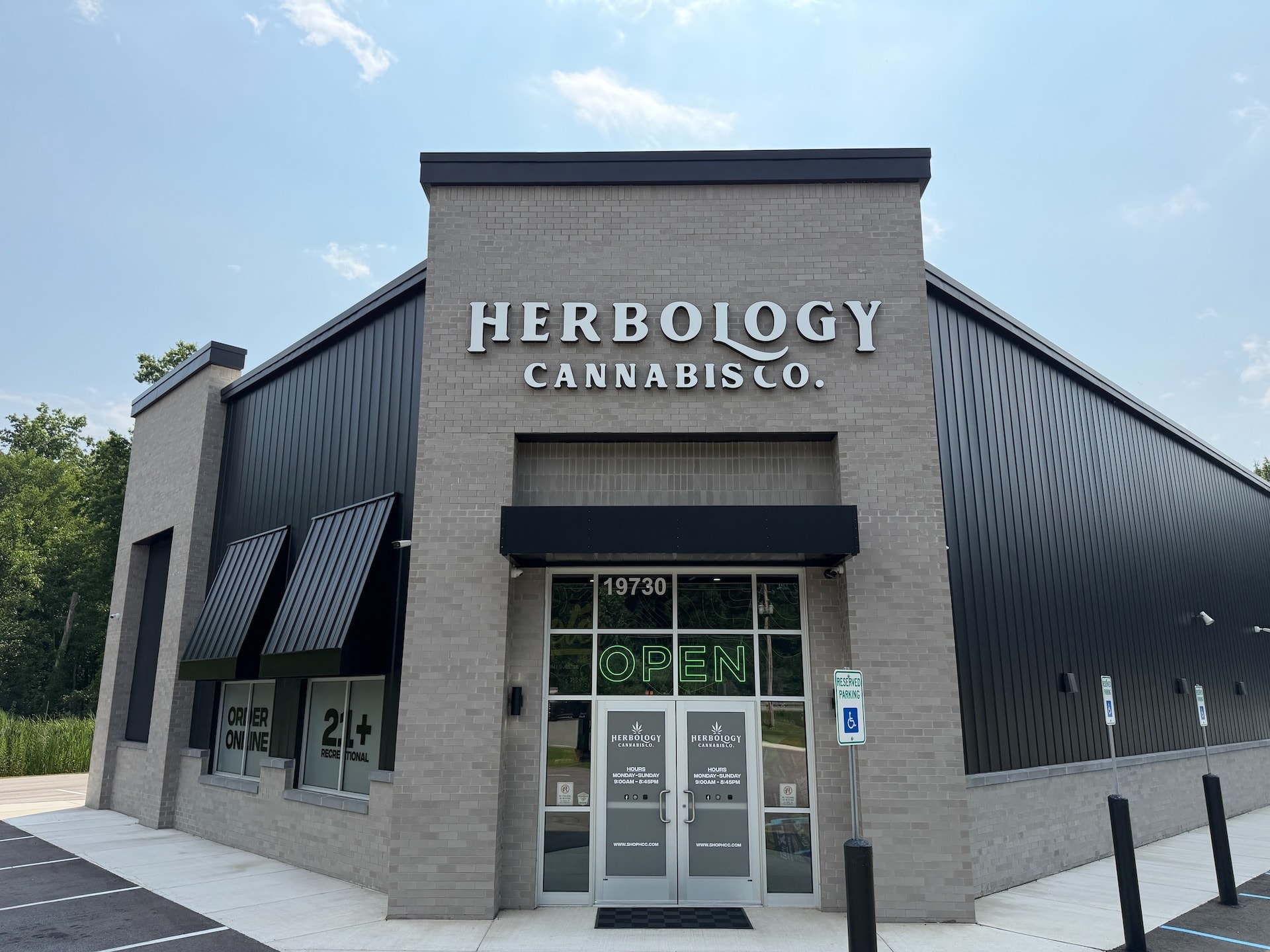 Herbology Cannabis Co. New Buffalo MI Storefront | Recreational Cannabis Dispensary Front entrance of Herbology Cannabis Co. recreational cannabis dispensary in New Buffalo, Michigan featuring the storefront, main entrance, and cannabis retail signage.